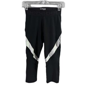 NWOT Bebe sports black and silver stripes capris